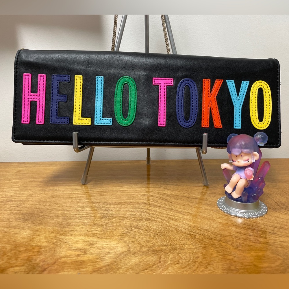 Kate Spade ‘Hello Tokyo' Black Leather Crossbody w/ Story book lining.